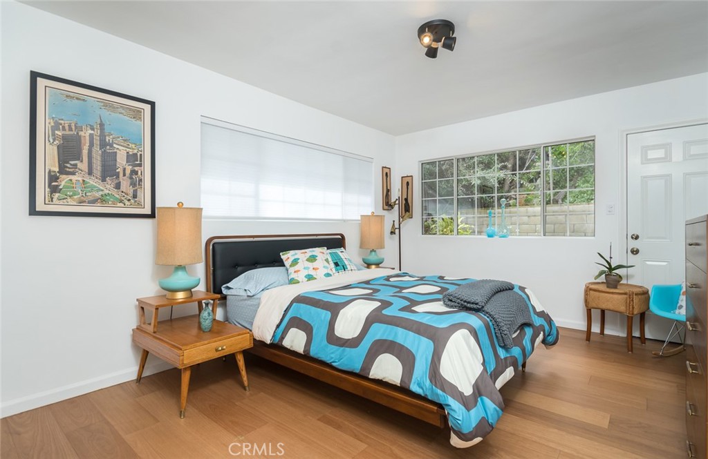 3611 El Lado Drive Glendale, CA 91208 - Photo 19 of 31 a bedroom with a bed and wooden floor