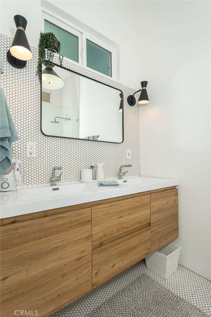 3611 El Lado Drive Glendale, CA 91208 - Photo 20 of 31 a bathroom with a sink vanity and mirror