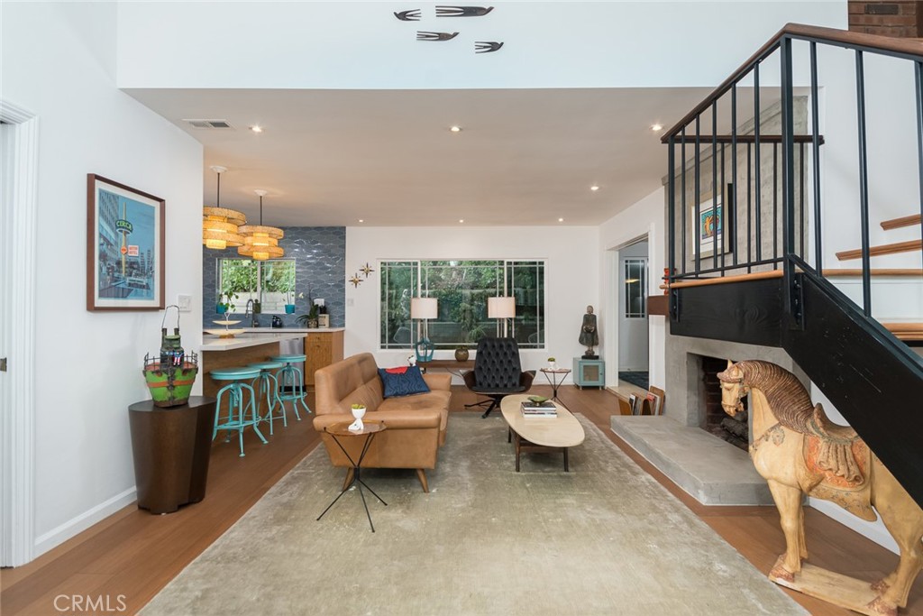 3611 El Lado Drive Glendale, CA 91208 - Photo 6 of 31 a living room with fireplace furniture and a large window