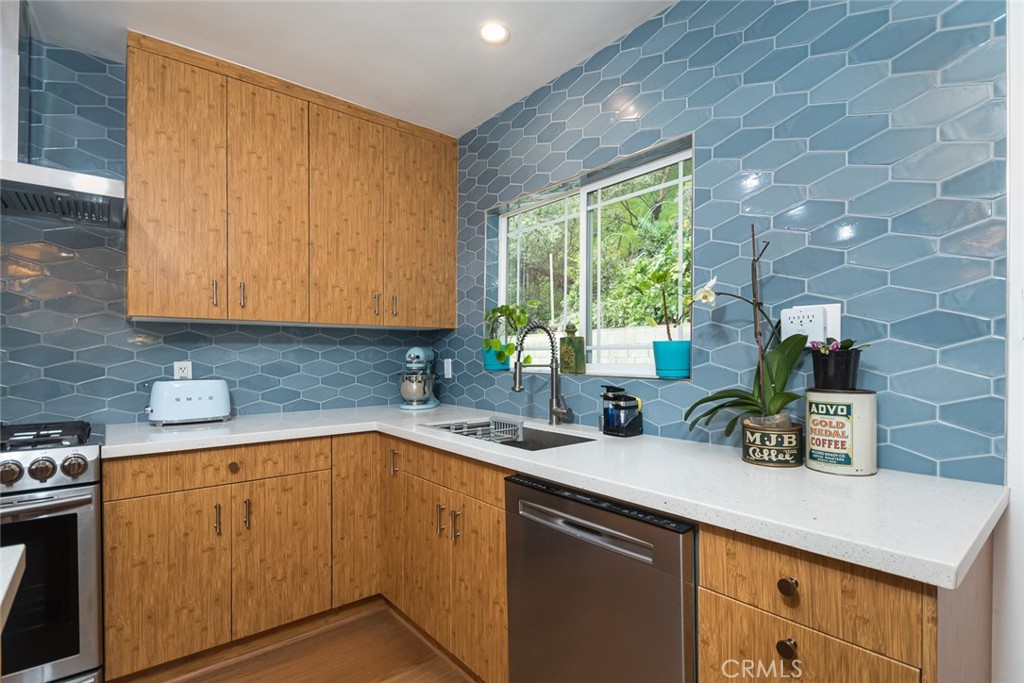 3611 El Lado Drive Glendale, CA 91208 - Photo 10 of 31 a kitchen with a sink cabinets and a window