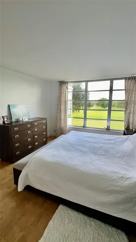 a view of a dining room with furniture and window