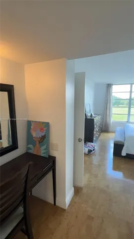 a bathroom with a toilet and a shower curtain