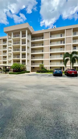 a view of car parked in front of a house