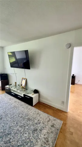 a kitchen with stainless steel appliances a stove a sink and a microwave