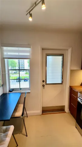 a kitchen with a sink appliances and cabinets