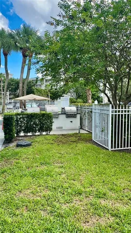 a view of a hallway view with wooden floor and staircase