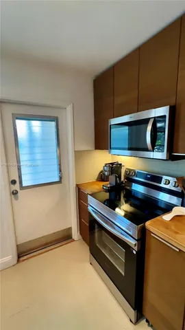 a hallway with a table and chairs