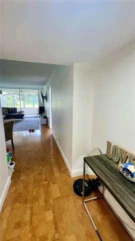 a bathroom with a sink vanity mirror and toilet