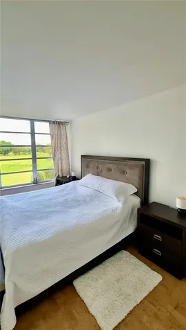 a bedroom with a bed and a table