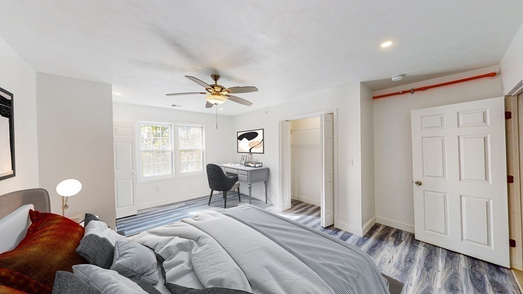 116 Malvern Road, Unit 2 Worcester, MA 01610 - Photo 4 of 14 a spacious bedroom with a bed and a window