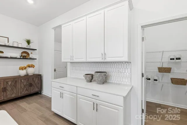 a kitchen with a cabinets and appliances