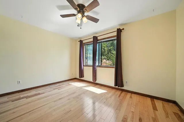 a bedroom with a bed and a bookshelf