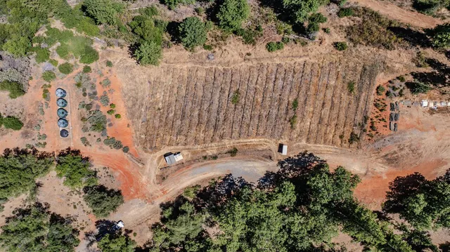 a view of a backyard of a house with outdoor seating