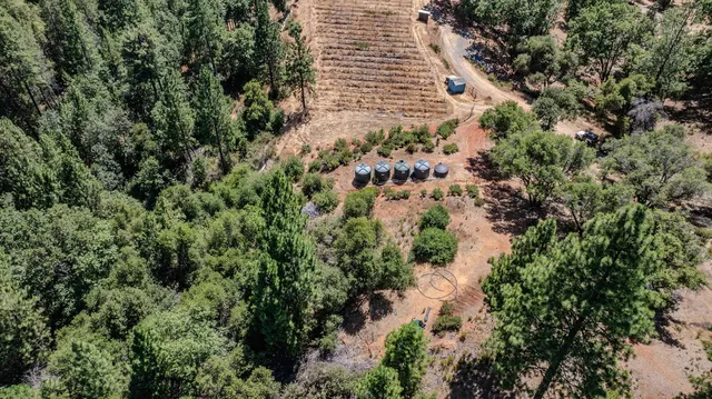 a view of house with trees in the background