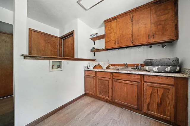 a view of a park with large trees