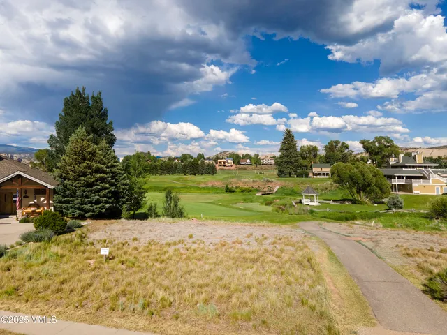 a view of a lake with a house in the background