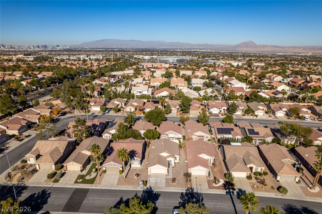 2189 Chapman Ranch Drive Henderson, NV 89012 - Photo 52 of 60 A quiet residential neighborhood of single-story homes sits against a backdrop of distant mountains.
