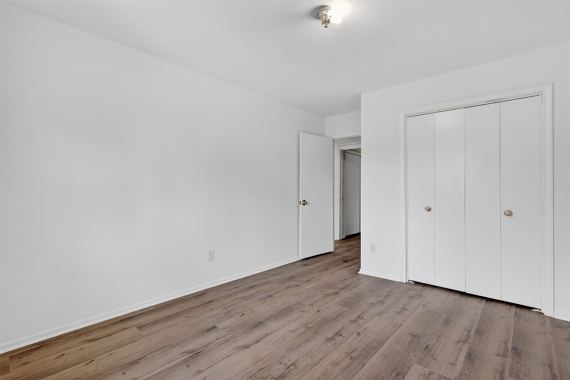 11807 South Ridgewood Circle Houston, TX 77071 - Photo 11 of 18 a view of an empty room with wooden floor