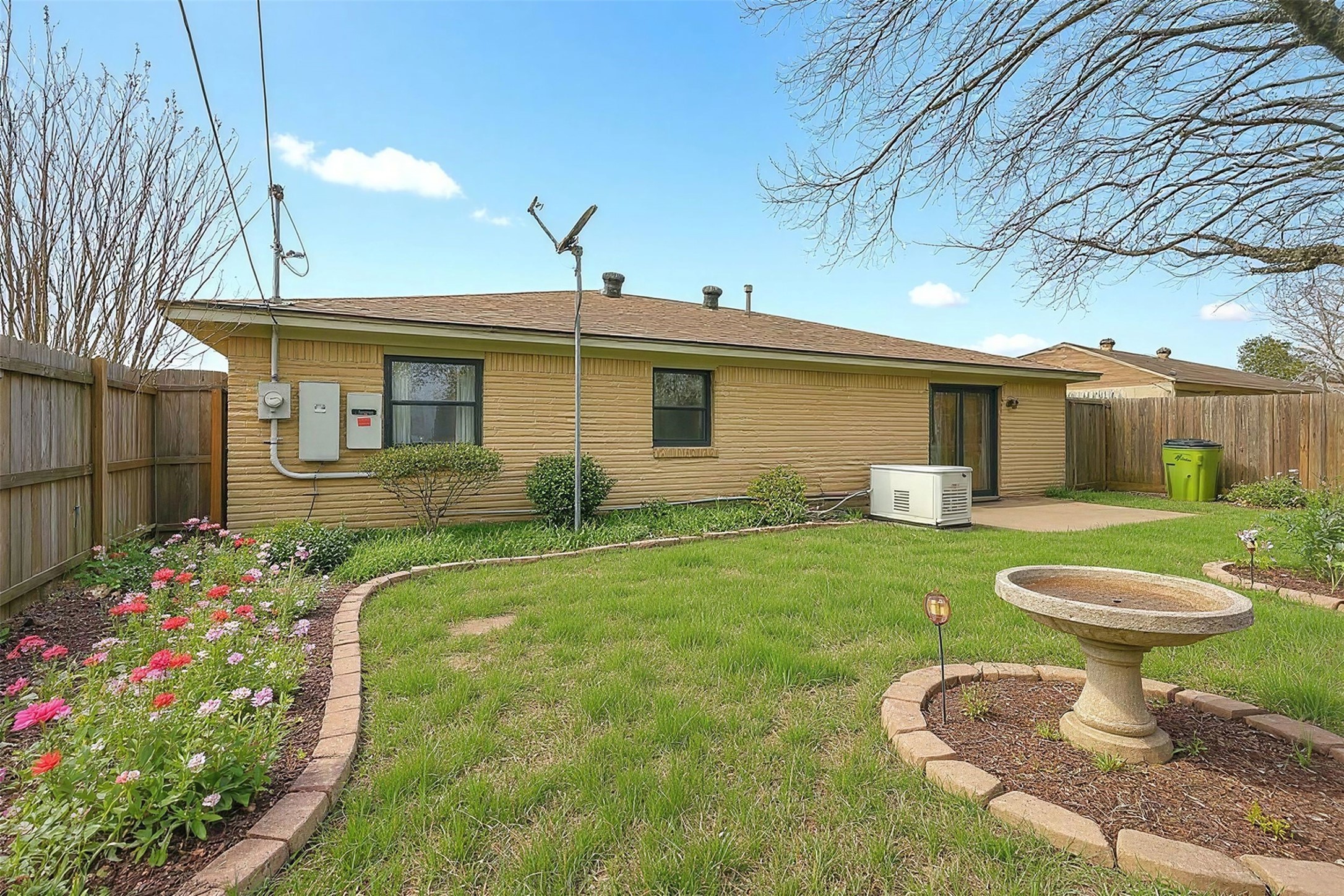 11807 South Ridgewood Circle Houston, TX 77071 - Photo 14 of 18 a front view of a house with garden
