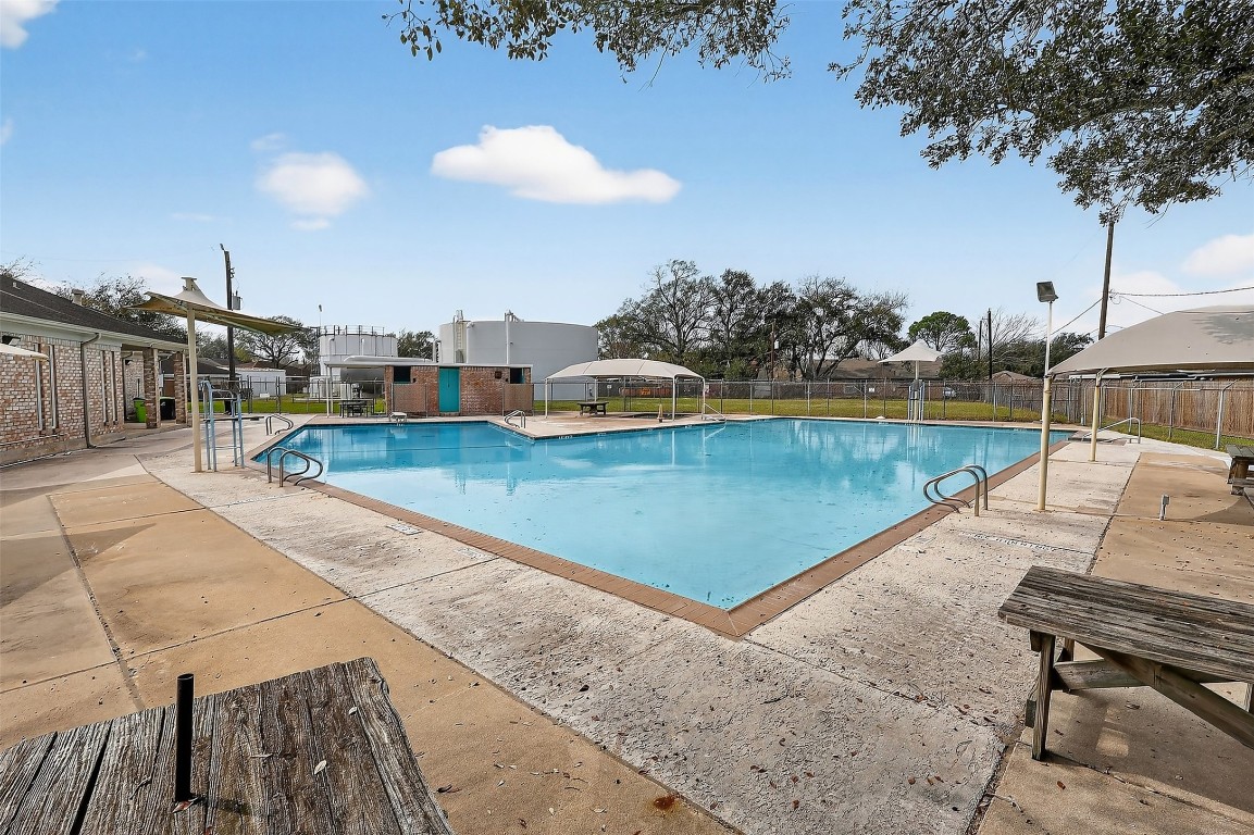 11807 South Ridgewood Circle Houston, TX 77071 - Photo 17 of 18 a view of a swimming pool with lounge chairs