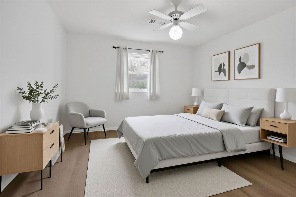 11807 South Ridgewood Circle Houston, TX 77071 - Photo 9 of 18 a bedroom with a bed and a chandelier