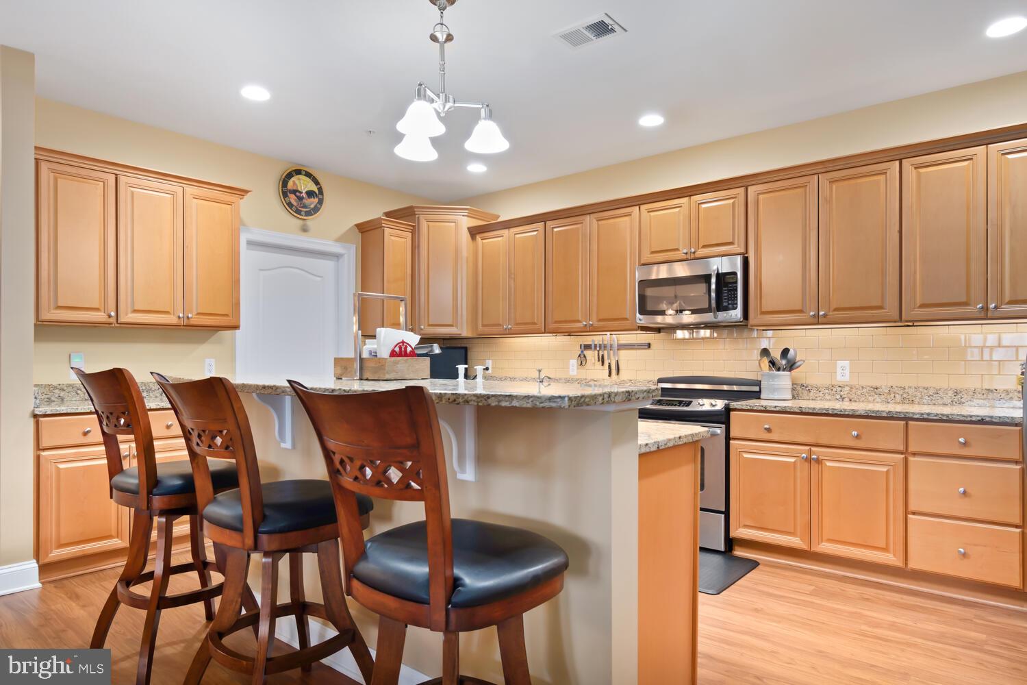 301 Muir Street, Unit 502 Cambridge, MD 21613 - Photo 13 of 53 Kitchen Island with Breakfast Bar