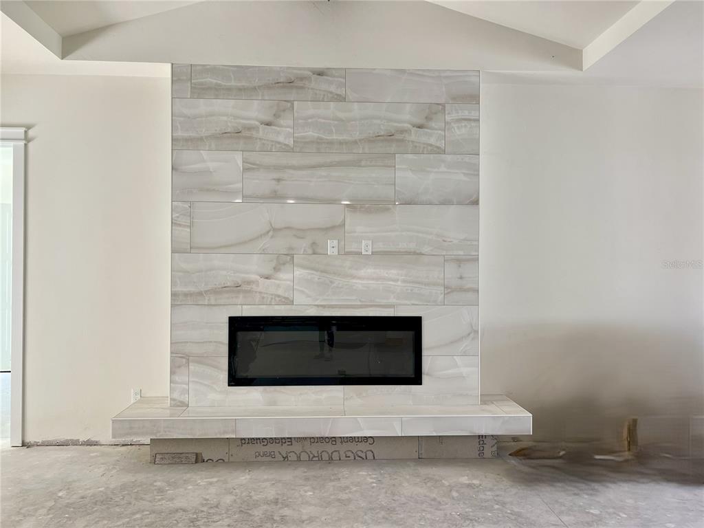 3189 Northwest 135th Way Gainesville, FL 32606 - Photo 14 of 16 a living room with a fireplace