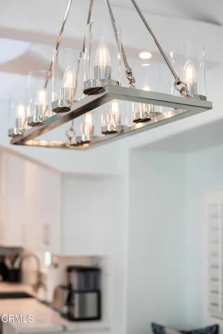 a view of a living room and chandelier