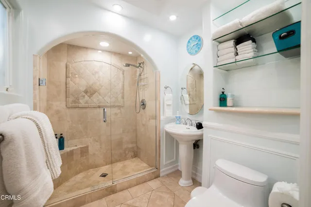 a bedroom with bed and wooden floor