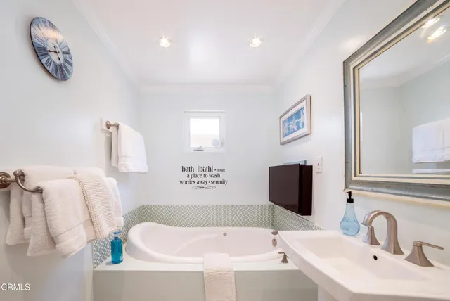 a bathroom with a shower and a sink