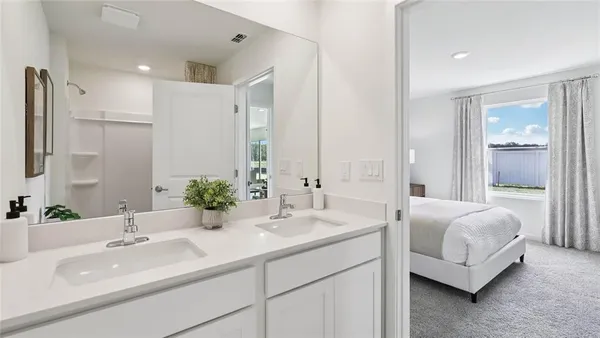 a bathroom with a double vanity sink and a mirror