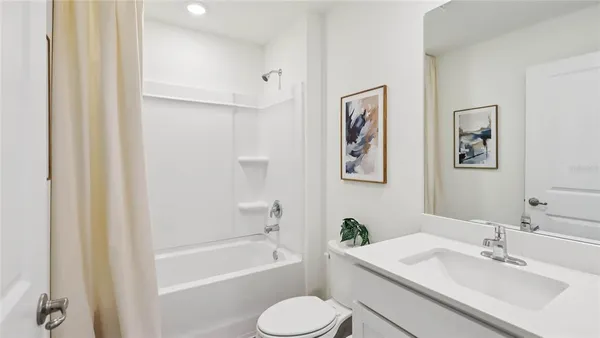 a bathroom with a sink toilet and bathtub