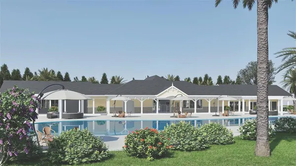 a front view of a residential houses with yard and green space