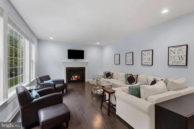 a view of a livingroom with furniture window and wooden floor