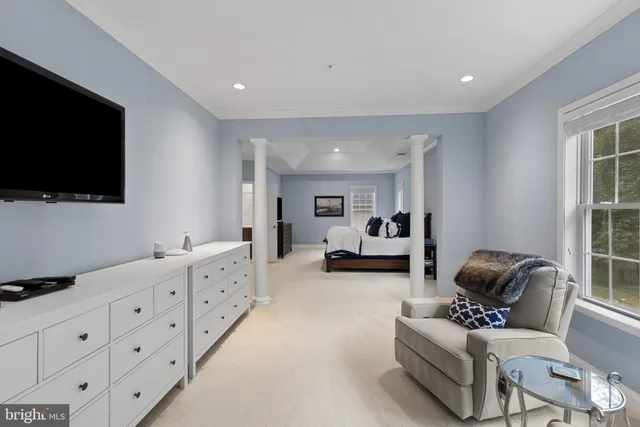 a bedroom with a bed and a table