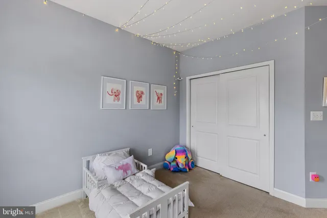 a living room with furniture and a piano