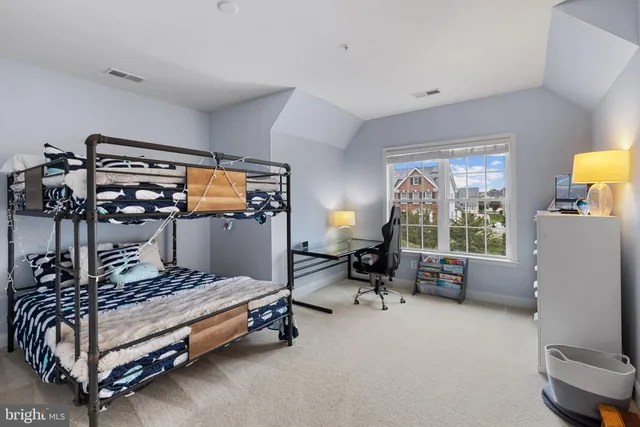 a view of a house with backyard sitting area and garden