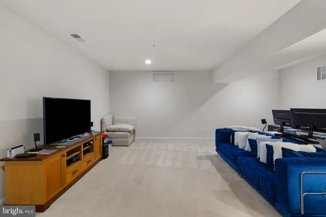 a view of a house with backyard sitting area and garden