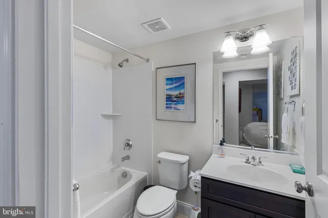 a view of backyard with outdoor seating and trees