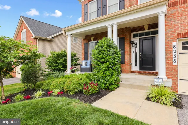 a outdoor living space with furniture and a potted plant