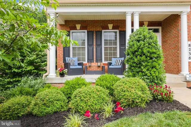 a view of a dining room with furniture wooden floor and chandelier