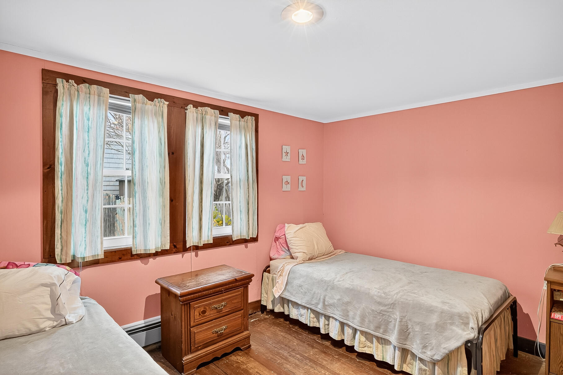 87 Spring Street Hyannis, MA 02601 - Photo 17 of 27 a bedroom with a bed and a window