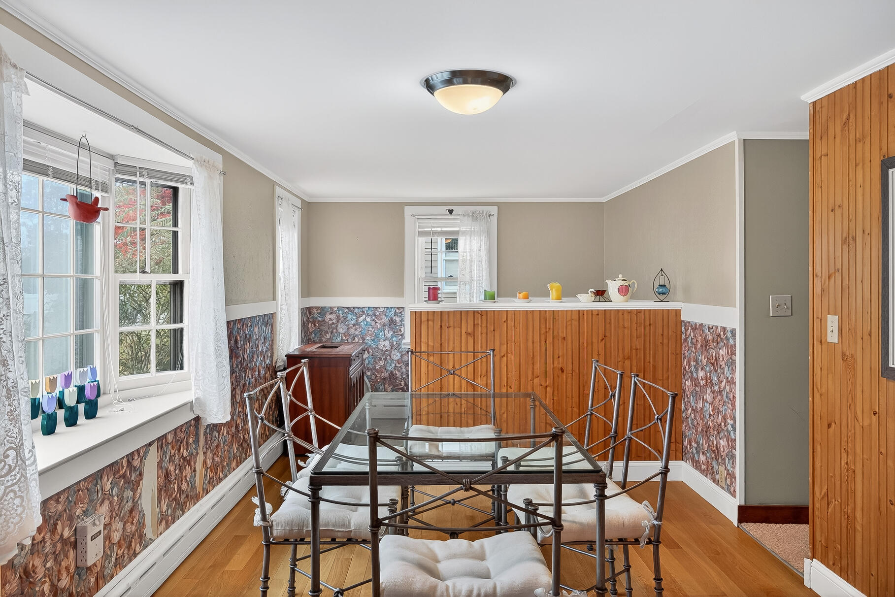 87 Spring Street Hyannis, MA 02601 - Photo 8 of 27 a view of a dining room with furniture and wooden floor
