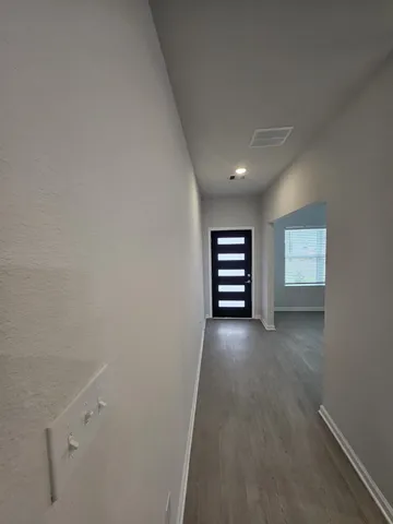 an empty room with a empty space and a window