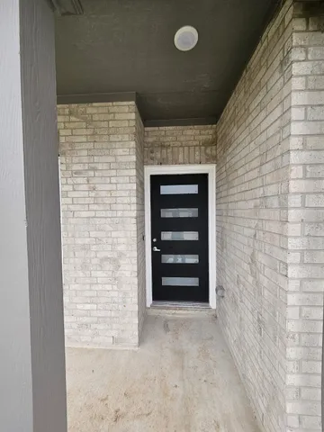 a view of empty room with a fireplace