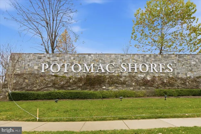 a view of outdoor space with signage and flags