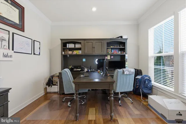 a workspace with furniture and window