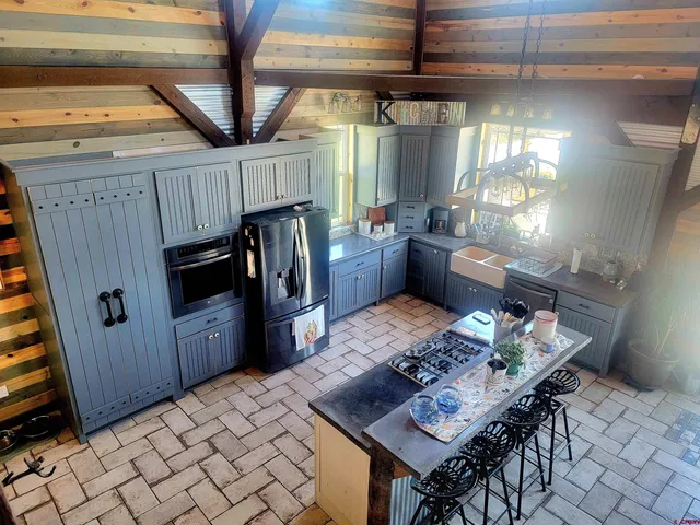a open kitchen with a table and chairs