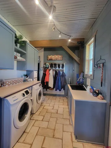 a bedroom with a bed and a potted plant