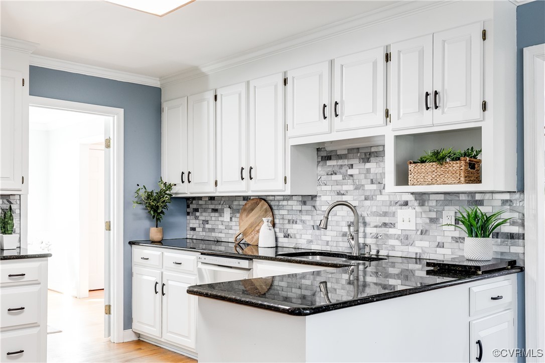 5300 Krag Road Chester, VA 23831 - Photo 11 of 33 a kitchen with granite countertop a sink a stove and cabinets